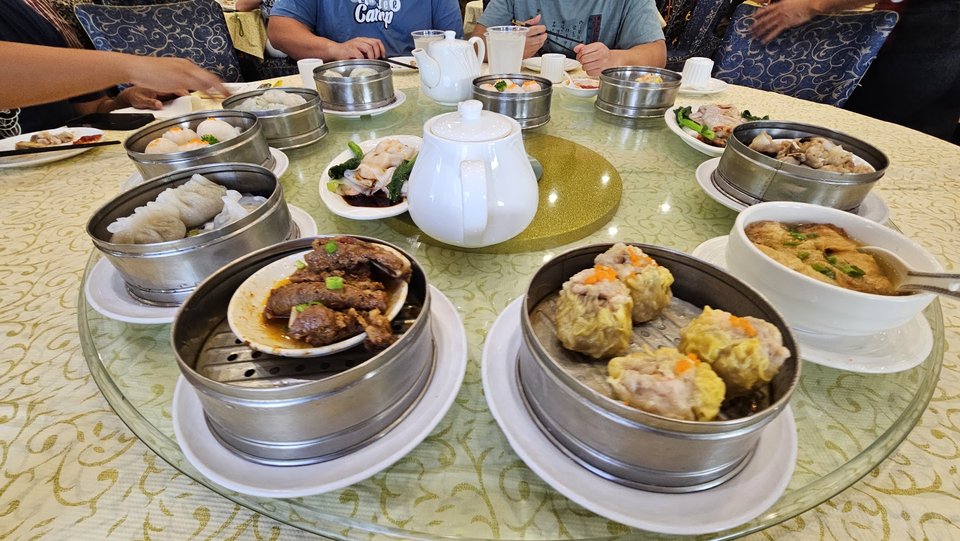 Chinese seafood dishes arranged for sharing.
